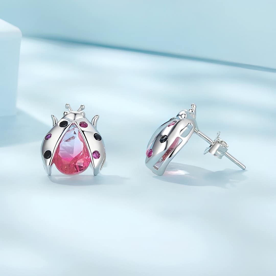 Exquisite Ladybug Stud Earrings | S925 Sterling Silver | Go Glam Girl 5 Exquisite Ladybug Stud Earrings: Sterling silver earrings with pink glass body, cubic zirconia-studded wings. Symbolic and whimsical jewelry for women. Perfect for adding charm and luck to your style.