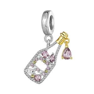 S925 sterling silver Sparkling Wine Bottle Dangle Charm. Intricately detailed bottle adorned with white, yellow, and dark pink cubic zirconia stones. Gold-plated neck and a dark pink cubic zirconia dangle resembling a drop of wine. A perfect accessory for wine enthusiasts. Enhance your style with this elegant French Picnic Charms Collection charm.