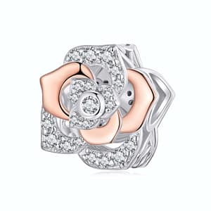 Sterling silver rose charm with rose gold petals and cubic zirconia stones, symbolic of love and beauty, perfect for jewelry lovers.