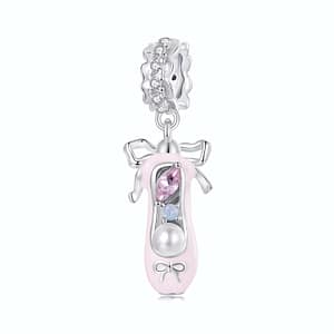 Sterling silver ballet shoe dangle charm with pink cubic zirconia stone and pearl accent. Elegant ballet-inspired jewelry for dance lovers.