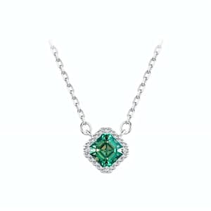 Elegant s925 sterling silver necklace with a 0.6 carat emerald green moissanite surrounded by sparkling cubic zirconia stones. Timeless sophistication for any occasion. #EmeraldMoissanite #FineJewelry
