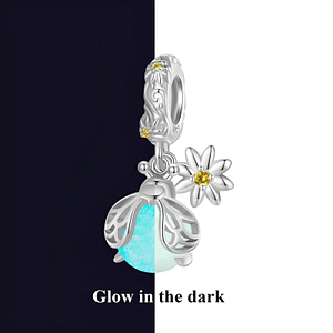 Glow in the dark firefly dangle charm made of s925 sterling silver with luminous stone abdomen, silver wings, and daisy pattern. Nature-inspired jewelry accessory.