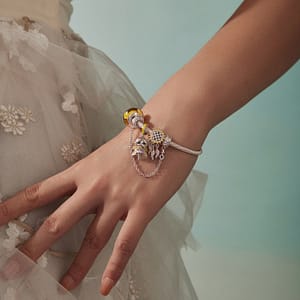 Discover Magic in Every Detail with the Fairy Charms Collection 11 S925 sterling silver Sunbeam Fairy charm with golden-yellow wings and lilac accents