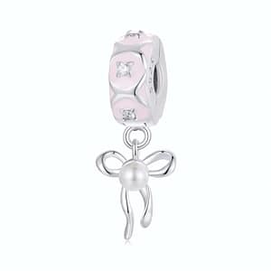 Ballet Ribbon Bow Clip Charm made of s925 sterling silver, adorned with cubic zirconia stones and a white pearl, perfect for ballet enthusiasts.
