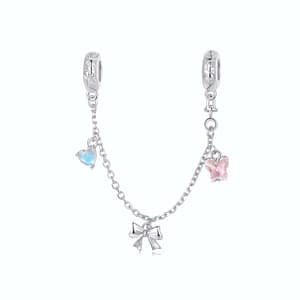 Sterling silver Ballet Safety Chain featuring pink butterfly, silver ribbon bow, and blue moonstone heart charms.