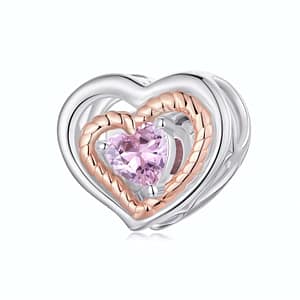 Rose gold heart charm featuring pink cubic zirconia stone, crafted from sterling silver. Elegant and romantic jewelry accessory.