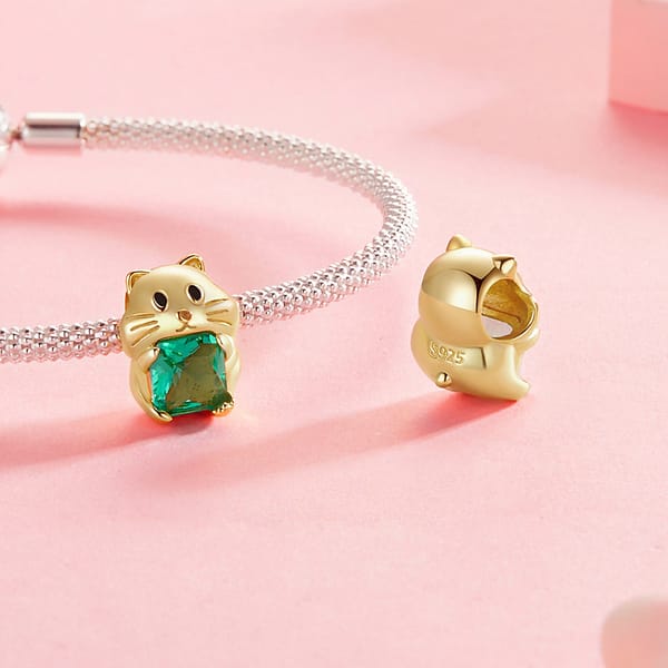Celebrate Your Love for Pets on National Love Your Pet Day 25 Cute Gold Hamster Charm crafted from s925 sterling silver with gold plating, featuring an adorable hamster holding a green transparent glass gemstone. Part of the Pet Charms Collection, ideal for animal lovers and jewelry enthusiasts.