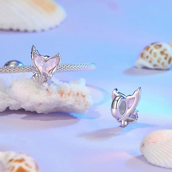 Dive into Style: 10 Must-Have Ocean-Inspired Jewelry Pieces of 2023 30 Mermaid Tail Stopper Charm in s925 sterling silver, featuring pink glass, shell, pearl, and opal stone embellishments.