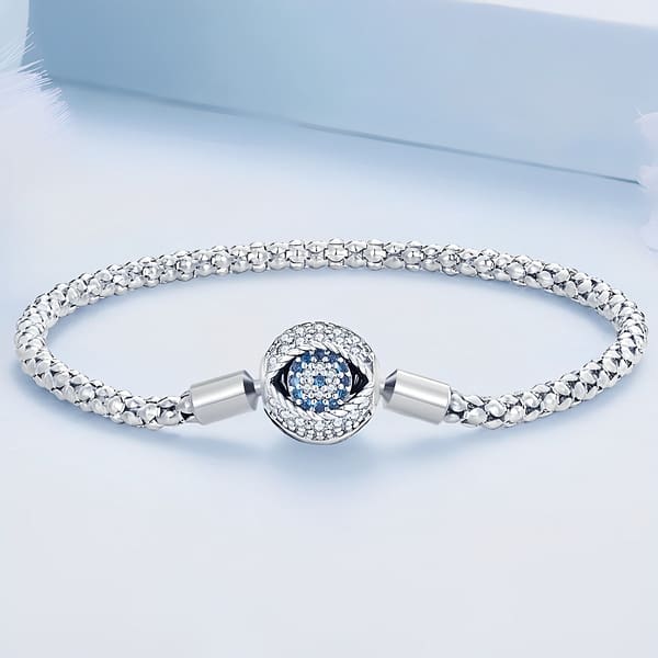 The power of Evil Eye and Hamsa symbols: protecting yourself and your loved ones 16 S925 Sterling Silver Evil Eye Bulb Charm Bracelet with Blue Cubic Zirconia Stones and Trendy Braided Pattern Chain. Personalizable Charm Bracelet for Protection and Style.