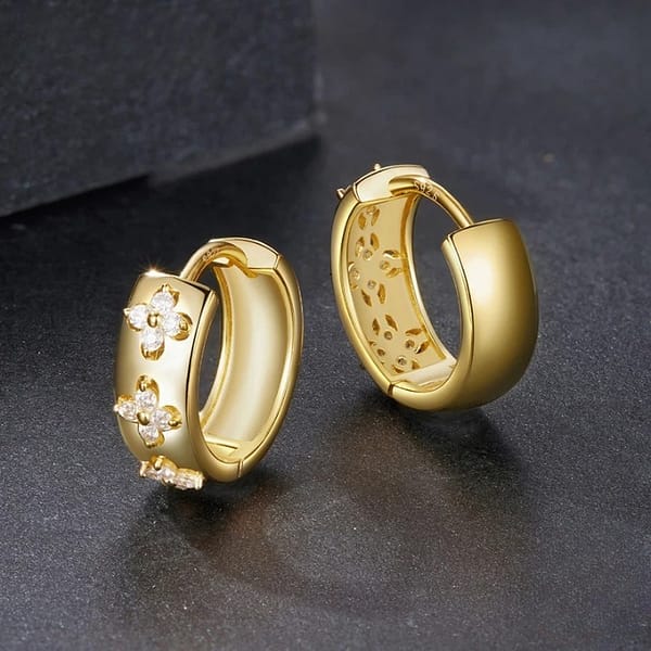 Affordable Glam: Moissanite Jewelry That Looks Expensive But Won't Break the Bank 20 These Golden Four Leaf Clovers Moissanite Hoop Earrings feature shimmering D-color moissanite stones arranged in delicate clover motifs. A timeless design that brings sparkle to every moment.