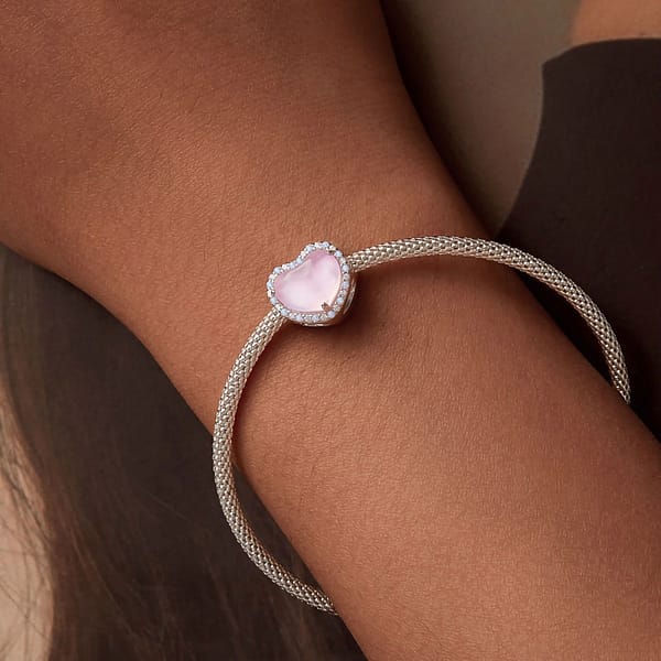 From Teddy Bears to Heartfelt Tokens: The Evolution of Love on Valentine's Day 15 S925 sterling silver Pink Heart Love Charm. Opulent opals, cubic zirconia, and pink enamel create a captivating Valentine's Day accessory. Perfect for the Teddy Bears Love Charms Collection. #LoveCharm #ValentinesGift #PinkHeartJewelry