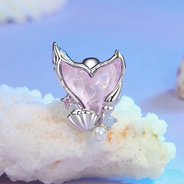 Dive into Style: 10 Must-Have Ocean-Inspired Jewelry Pieces of 2023 28 Mermaid Tail Stopper Charm in s925 sterling silver, featuring pink glass, shell, pearl, and opal stone embellishments.