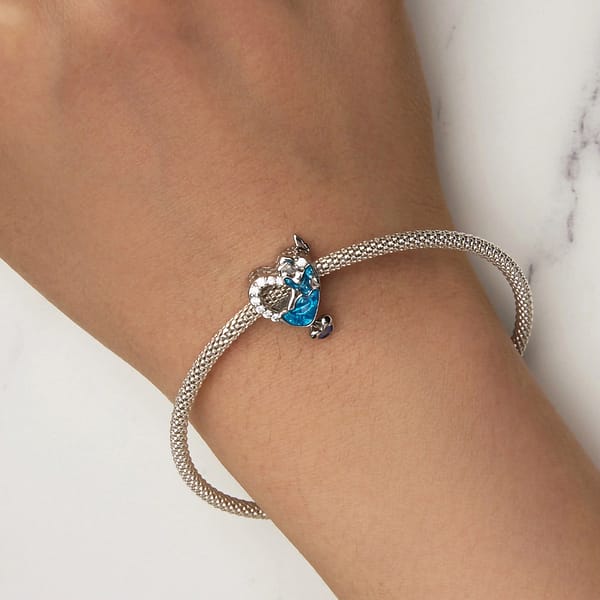 Buzzworthy Beauties: 10 Must-Have Bug-Inspired Jewelry Pieces of 2023 26 Close-up image of a Cinderella Heart Charm made of s925 sterling silver, featuring Cinderella in a blue dress, engraved text "Strong and brave, kind and kind," blue butterflies, and a hanging crystal heart.