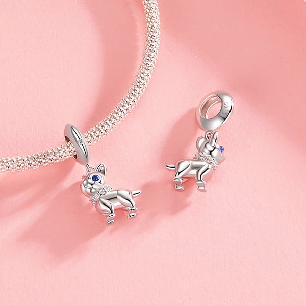 Celebrate Your Love for Pets on National Love Your Pet Day 15 Sterling silver French Bulldog dangle charm with blue spinel eyes, cubic zirconia collar, and white gold plating. A perfect pet-lover charm for bracelets & necklaces.
