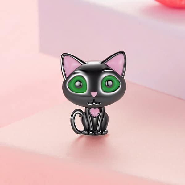 Celebrate Your Love for Pets on National Love Your Pet Day 22 Cute Black Cat Charm made of s925 sterling silver, plated in black gold, with green enamel eyes and pink heart details. Part of the Pet Charms Collection, perfect for cat lovers and charm collectors.