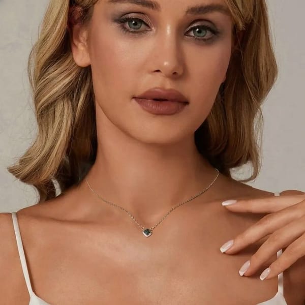 Affordable Glam: Moissanite Jewelry That Looks Expensive But Won't Break the Bank 38 Elegant s925 sterling silver necklace with a 0.6 carat emerald green moissanite surrounded by sparkling cubic zirconia stones. Timeless sophistication for any occasion. #EmeraldMoissanite #FineJewelry
