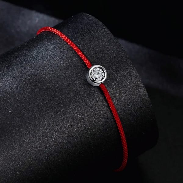 Affordable Glam: Moissanite Jewelry That Looks Expensive But Won't Break the Bank 25 Moissanite Red Rope Bracelet with 1-carat stone on silver extension. Exquisite jewelry for elegance and style.