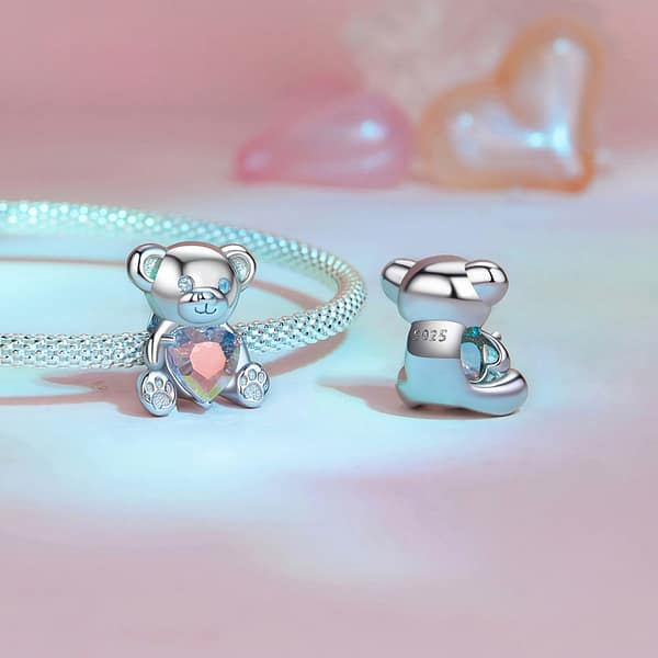 From Teddy Bears to Heartfelt Tokens: The Evolution of Love on Valentine's Day 22 Sterling silver Pink Heart Teddy Bear Love Charm, a whimsical addition to our Teddy Bears Love Charms Collection. Adorned with opal eyes, perfect for Valentine's Day. Combine with other charms to create 'I Love U.' #LoveCharm #ValentinesJewelry #TeddyBearCharm