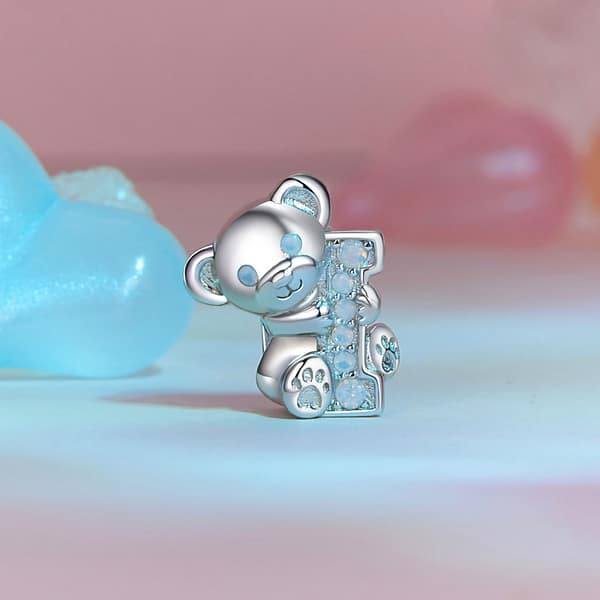 From Teddy Bears to Heartfelt Tokens: The Evolution of Love on Valentine's Day 29 Sterling silver Teddy Bear Love Charm, a romantic accessory for Valentine's Day. Opal-studded bear hugs the letter 'I'. Create 'I Love U' with our charming collection. Perfect gift for a loved one. #TeddyBearCharm #ValentinesJewelry #LoveGift
