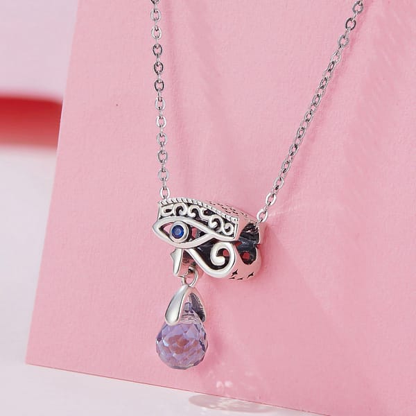 The power of Evil Eye and Hamsa symbols: protecting yourself and your loved ones 11 Sterling silver Eye of Horus charm with blue glass drop, symbolizing protection and warding off negativity. Ancient Egyptian inspired design.