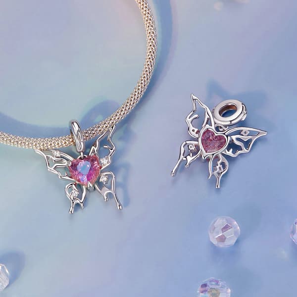 Buzzworthy Beauties: 10 Must-Have Bug-Inspired Jewelry Pieces of 2023 38 Sleeping Beauty Butterfly Charm: Sterling silver butterfly with red glass heart center and cubic zirconia stones.