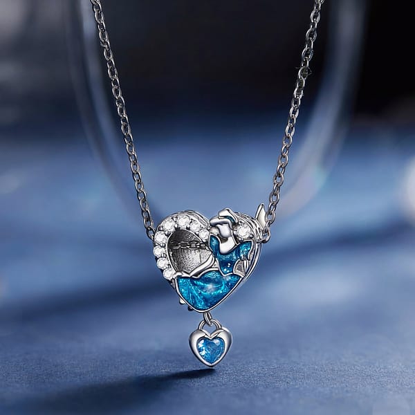 Buzzworthy Beauties: 10 Must-Have Bug-Inspired Jewelry Pieces of 2023 25 Close-up image of a Cinderella Heart Charm made of s925 sterling silver, featuring Cinderella in a blue dress, engraved text "Strong and brave, kind and kind," blue butterflies, and a hanging crystal heart.