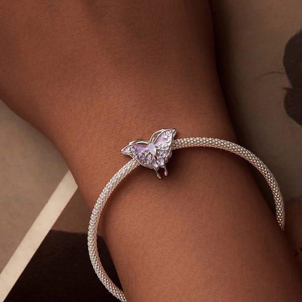 Buzzworthy Beauties: 10 Must-Have Bug-Inspired Jewelry Pieces of 2023 26 Sterling silver butterfly charm with opal stone, part of Monet's Garden Charms Collection, nature-inspired jewelry.