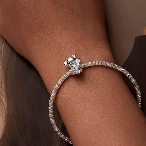 From Teddy Bears to Heartfelt Tokens: The Evolution of Love on Valentine's Day 30 Sterling silver Teddy Bear Love Charm, a romantic accessory for Valentine's Day. Opal-studded bear hugs the letter 'I'. Create 'I Love U' with our charming collection. Perfect gift for a loved one. #TeddyBearCharm #ValentinesJewelry #LoveGift