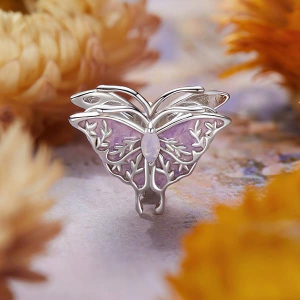 Buzzworthy Beauties: 10 Must-Have Bug-Inspired Jewelry Pieces of 2023 25 Sterling silver butterfly charm with opal stone, part of Monet's Garden Charms Collection, nature-inspired jewelry.