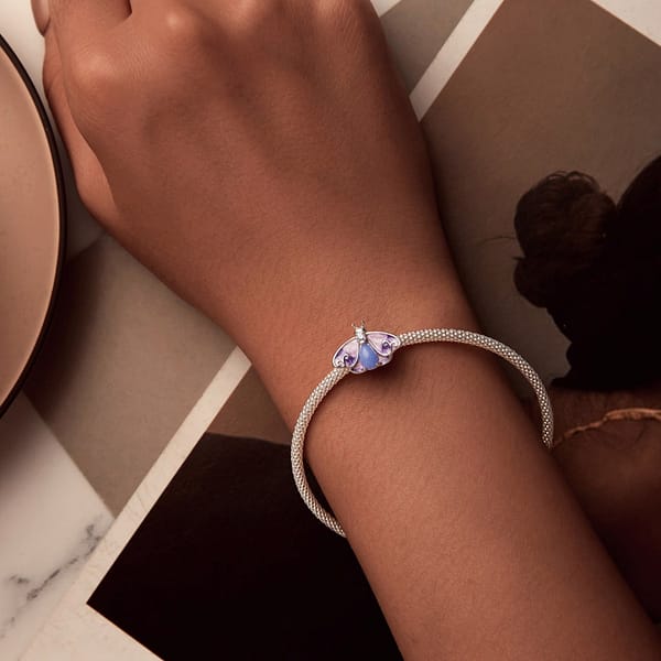 Buzzworthy Beauties: 10 Must-Have Bug-Inspired Jewelry Pieces of 2023 41 S925 sterling silver Luminous Purple Moth Stopper Charm. Rich purple hues, sparkling cubic zirconia, and a glowing lower body. Perfect for spring. From the Luminous Night Charms Collection.