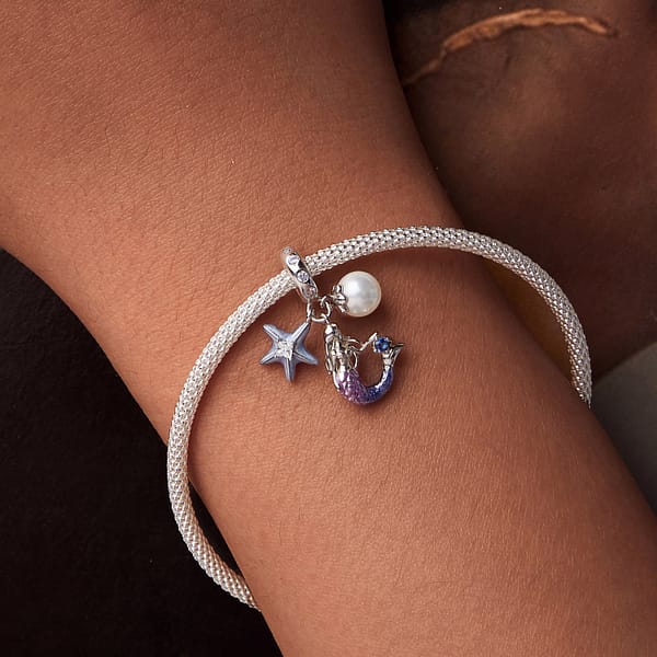 Dive into Style: 10 Must-Have Ocean-Inspired Jewelry Pieces of 2023 36 Mermaid Dangle Charm featuring a pink and purple mermaid, green enamel starfish with cubic zirconia, and shell pearl.