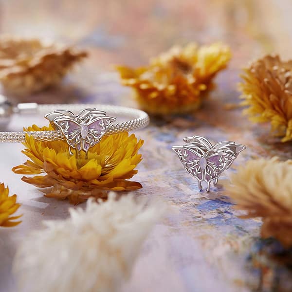 Buzzworthy Beauties: 10 Must-Have Bug-Inspired Jewelry Pieces of 2023 23 Sterling silver butterfly charm with opal stone, part of Monet's Garden Charms Collection, nature-inspired jewelry.