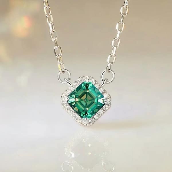 Affordable Glam: Moissanite Jewelry That Looks Expensive But Won't Break the Bank 37 Elegant s925 sterling silver necklace with a 0.6 carat emerald green moissanite surrounded by sparkling cubic zirconia stones. Timeless sophistication for any occasion. #EmeraldMoissanite #FineJewelry