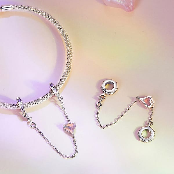 From Teddy Bears to Heartfelt Tokens: The Evolution of Love on Valentine's Day 7 S925 sterling silver Pink Heart Love Safety Chain Charm with opal stones. Elegant two-stopper design, perfect for securing your style with love. Ideal for Valentine's Day gifting.